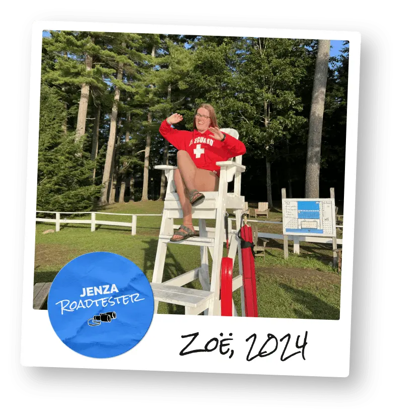 Author Zoe sat in a lifeguard chair at summer camp