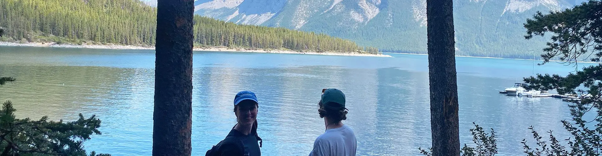 Girls beside lake in shade