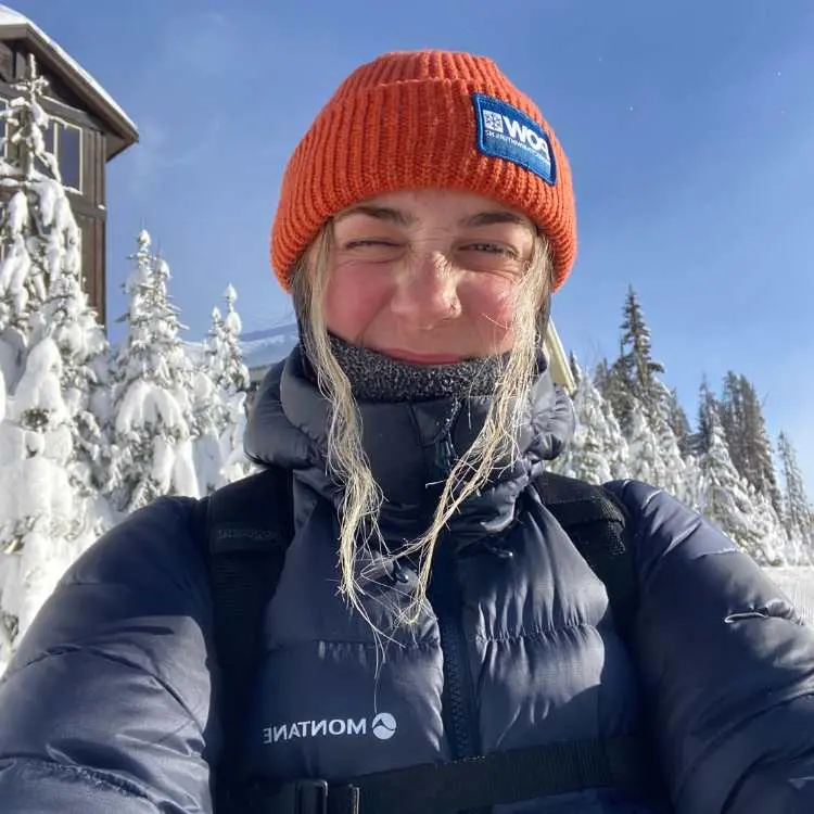 Young girl in orange beanie in snowy Canada