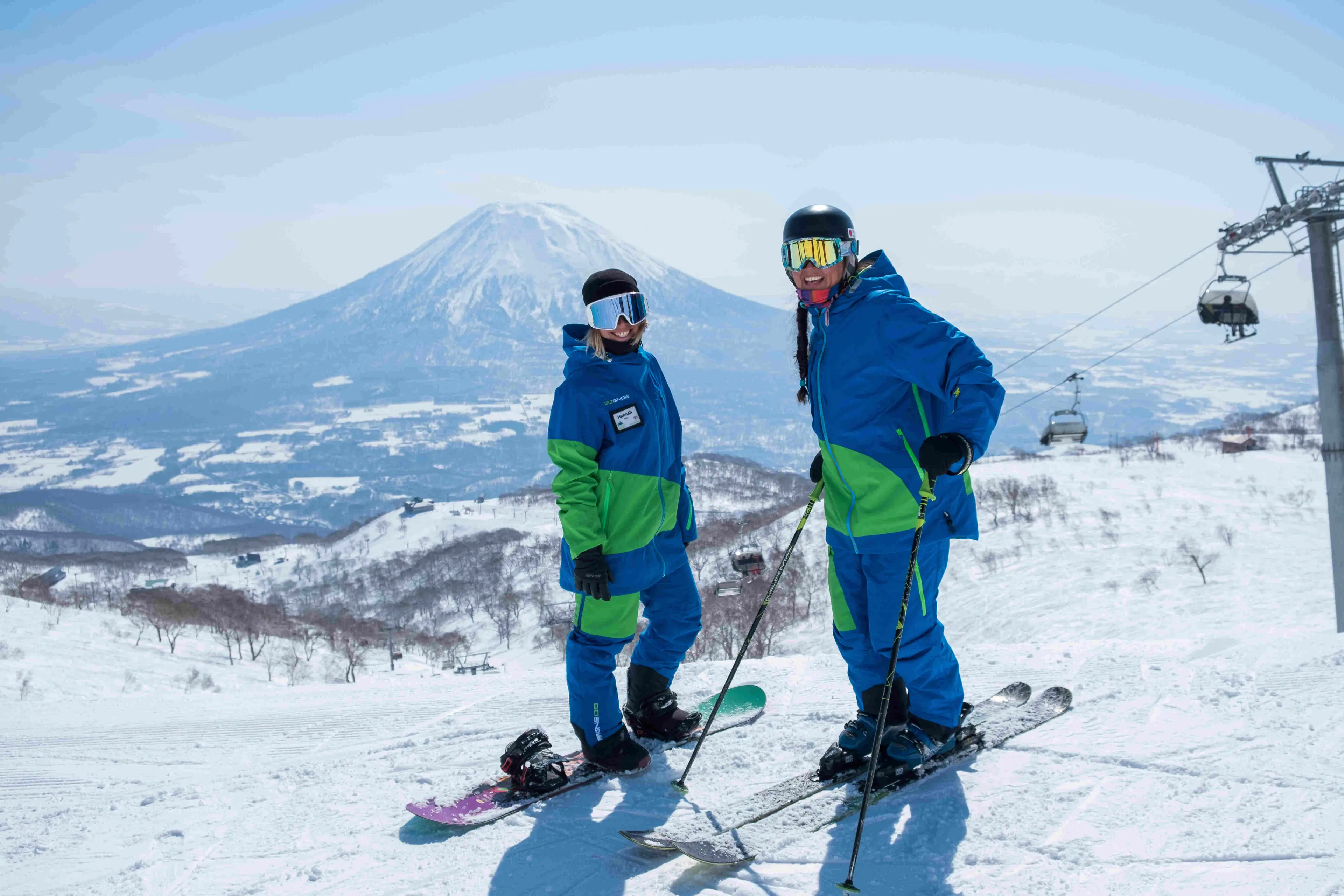 Two ski staff on a mountain in Japan 