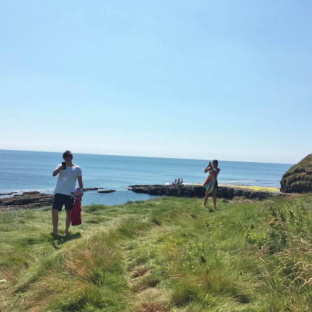 Guy and girl on coast sunny day