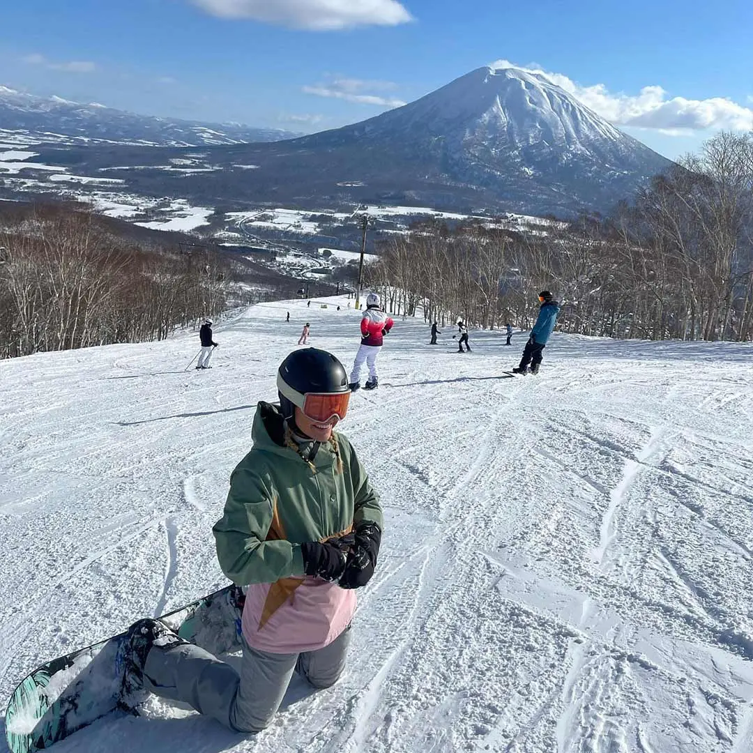 Girl poses on snowy mountain