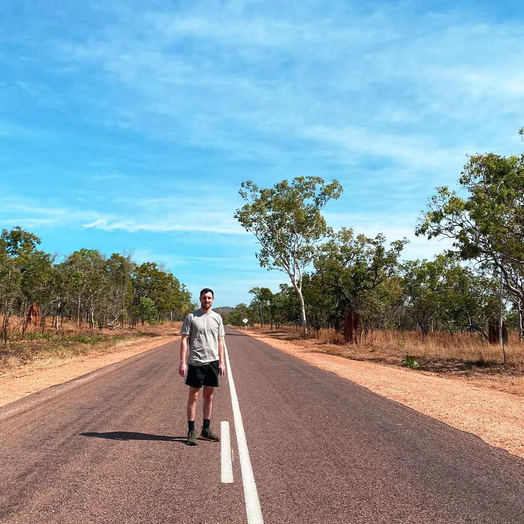 Guy stand in middle of road in Australia