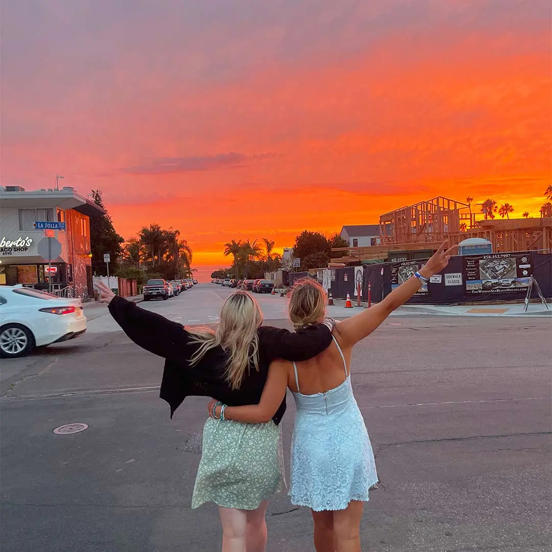 Girls walking into sunset