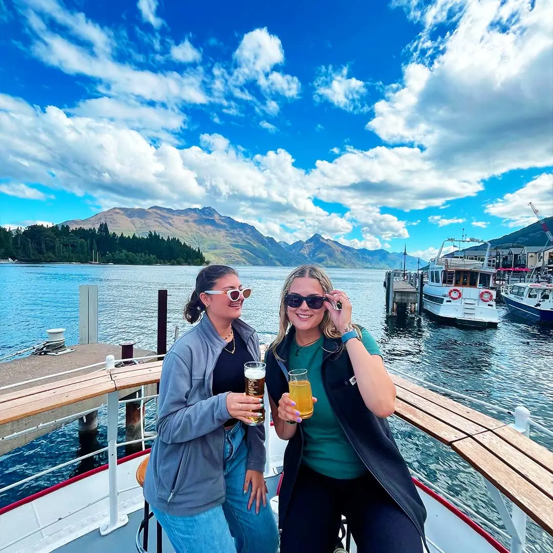 Girls pose with beers