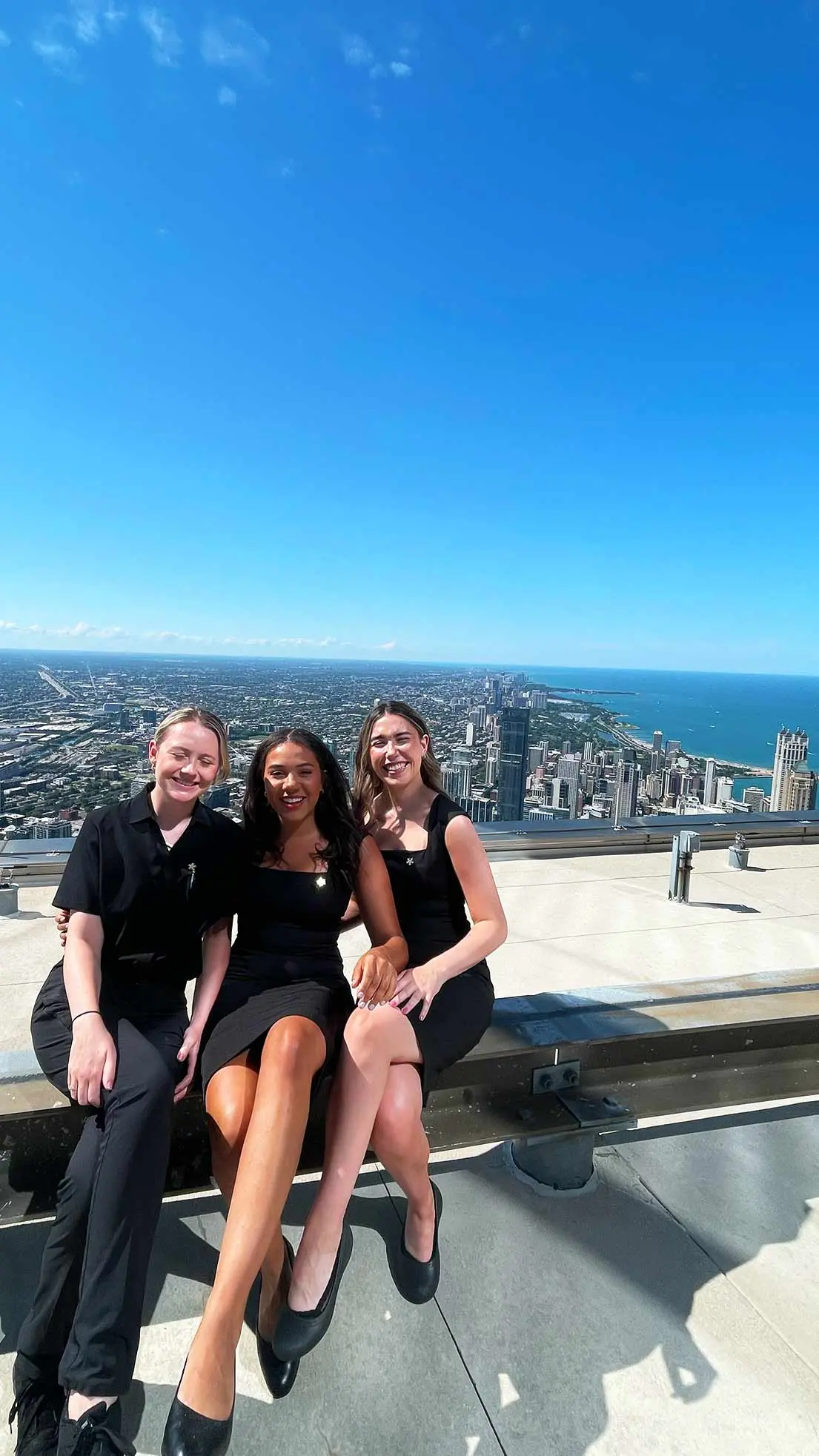 Staff of hotel sit on roof in Chicago