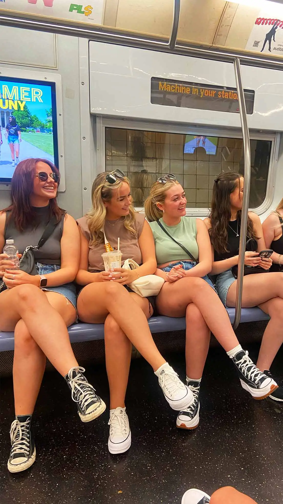 4 girls sit on NYC subway look similar