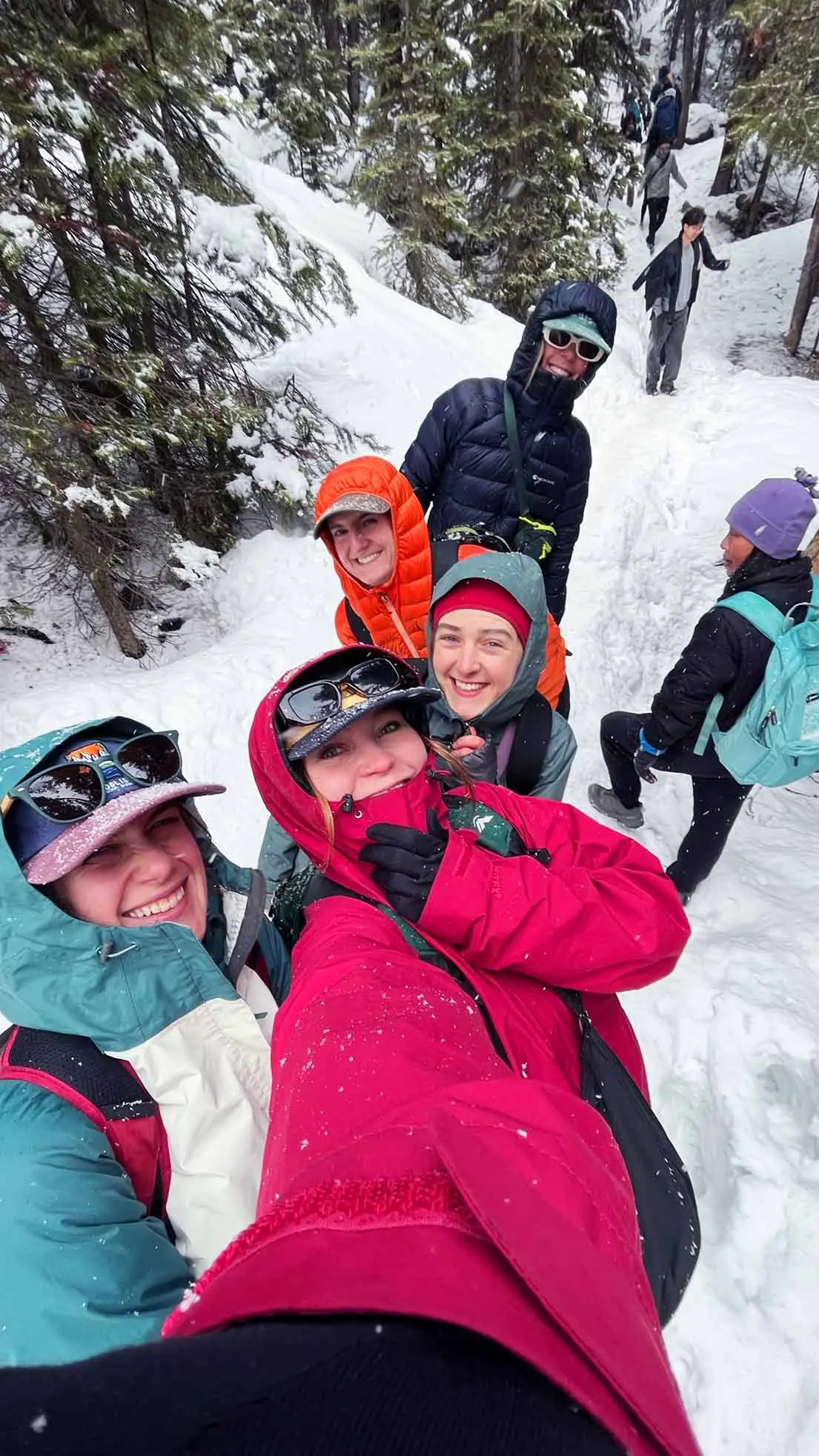 Friends take selfie in snowy woods