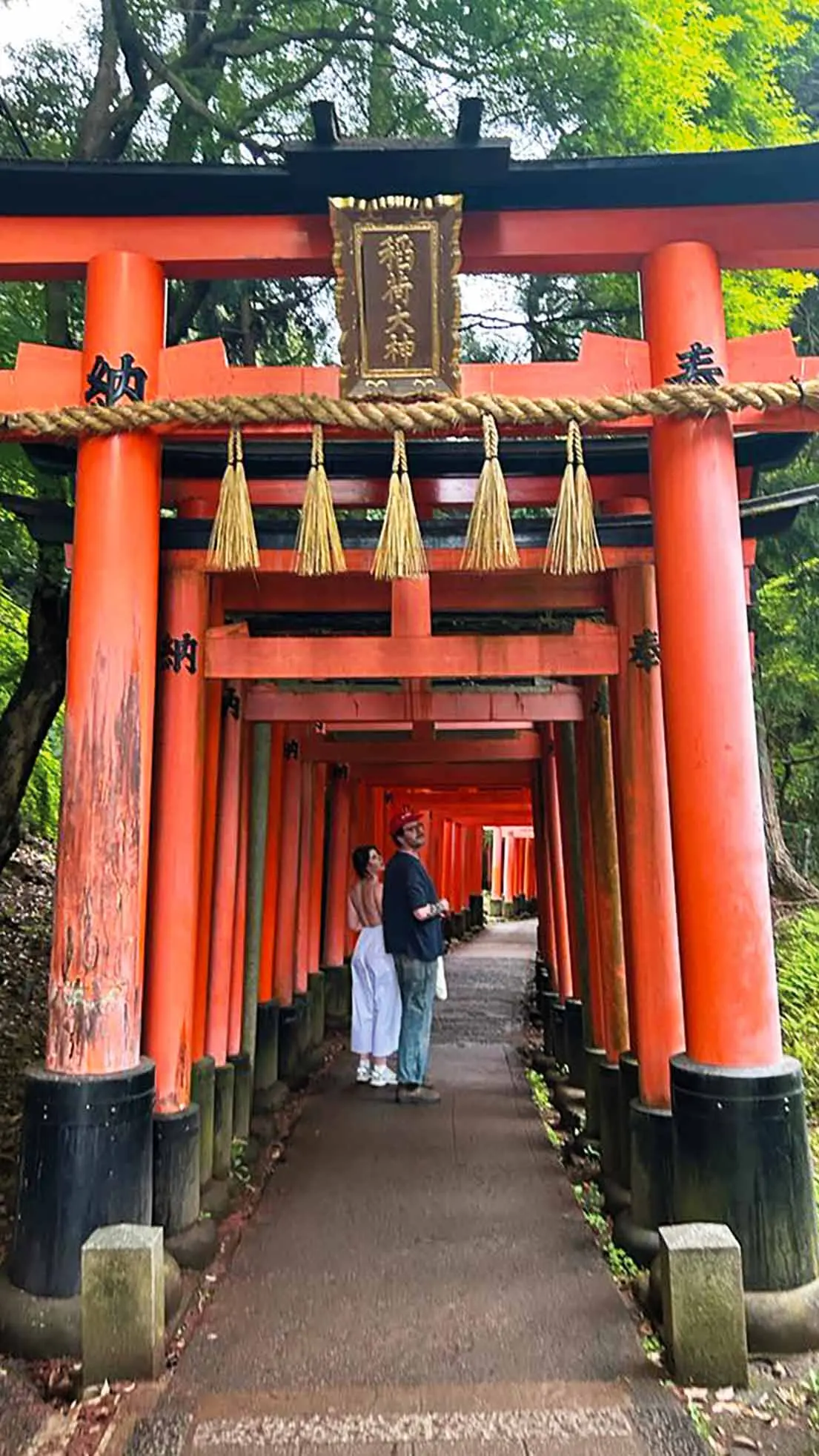 Girl and guy in Japanese arches