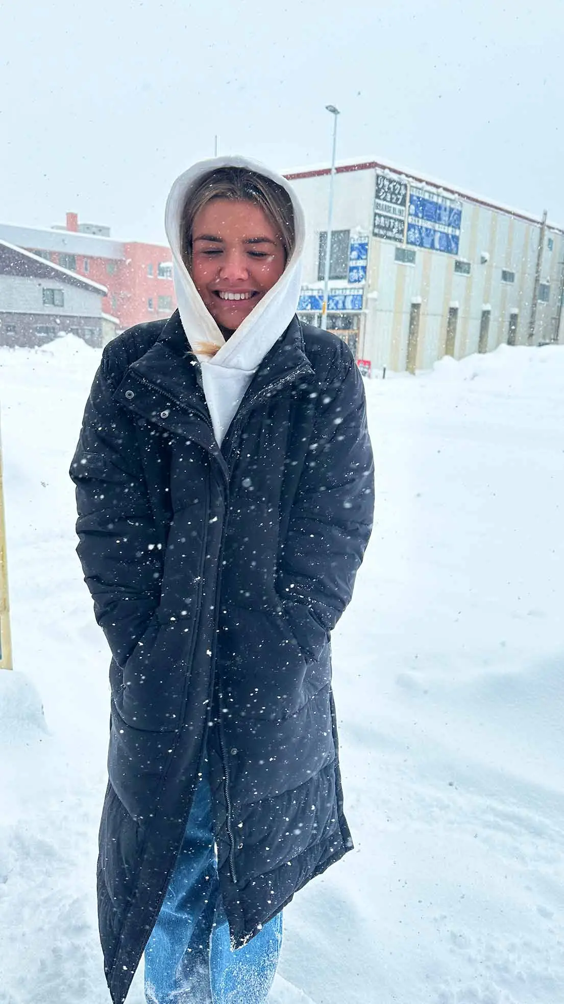 Girl in layers in the snow