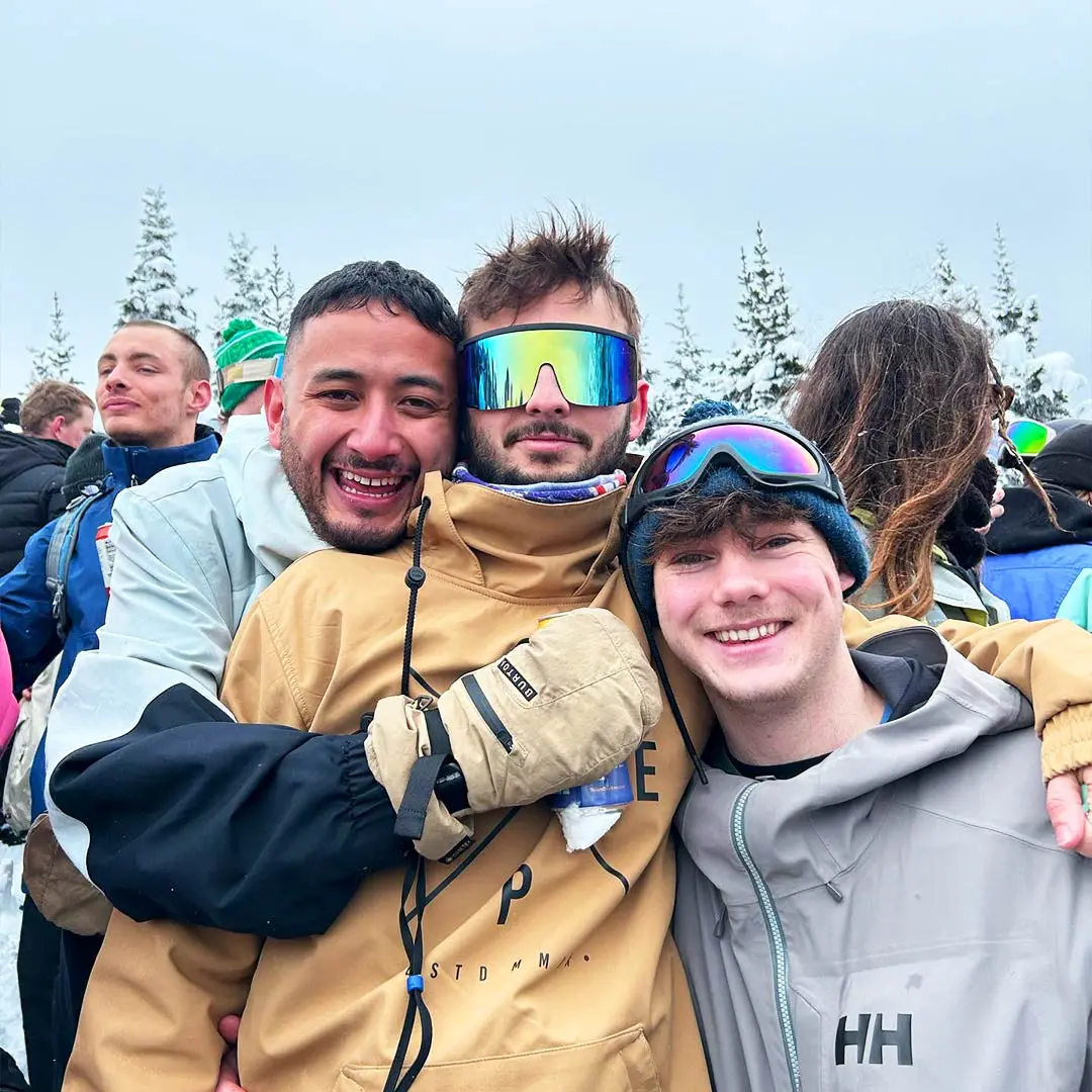 Guys having fun on the snowy mountain