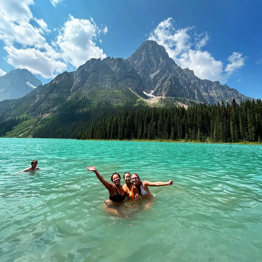 Girls in turqoise lake