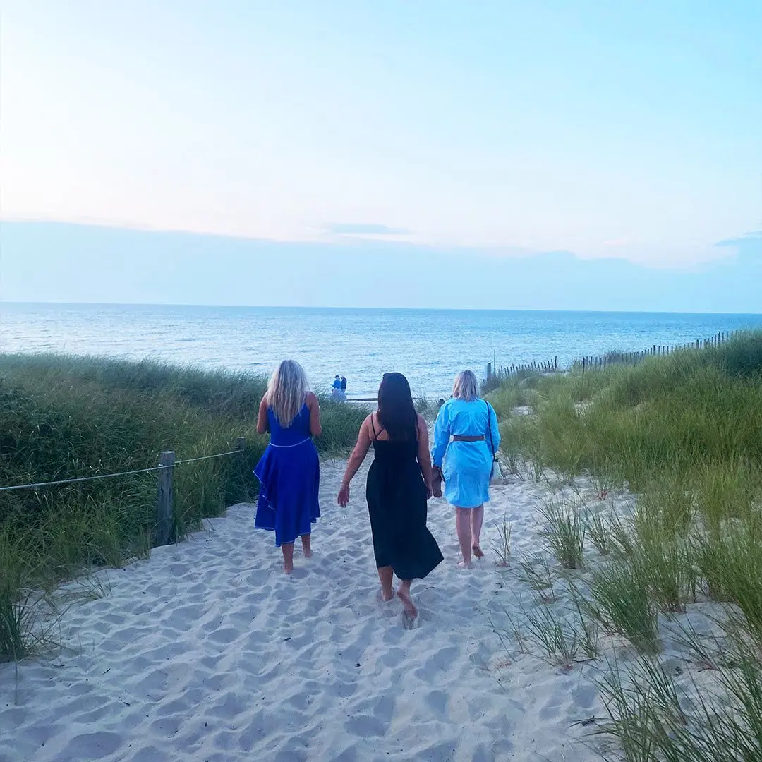 Girls walk towards beach