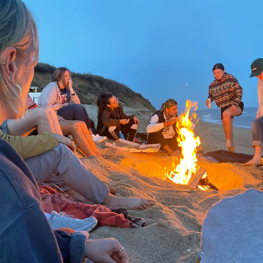 Campfire on beach with friends