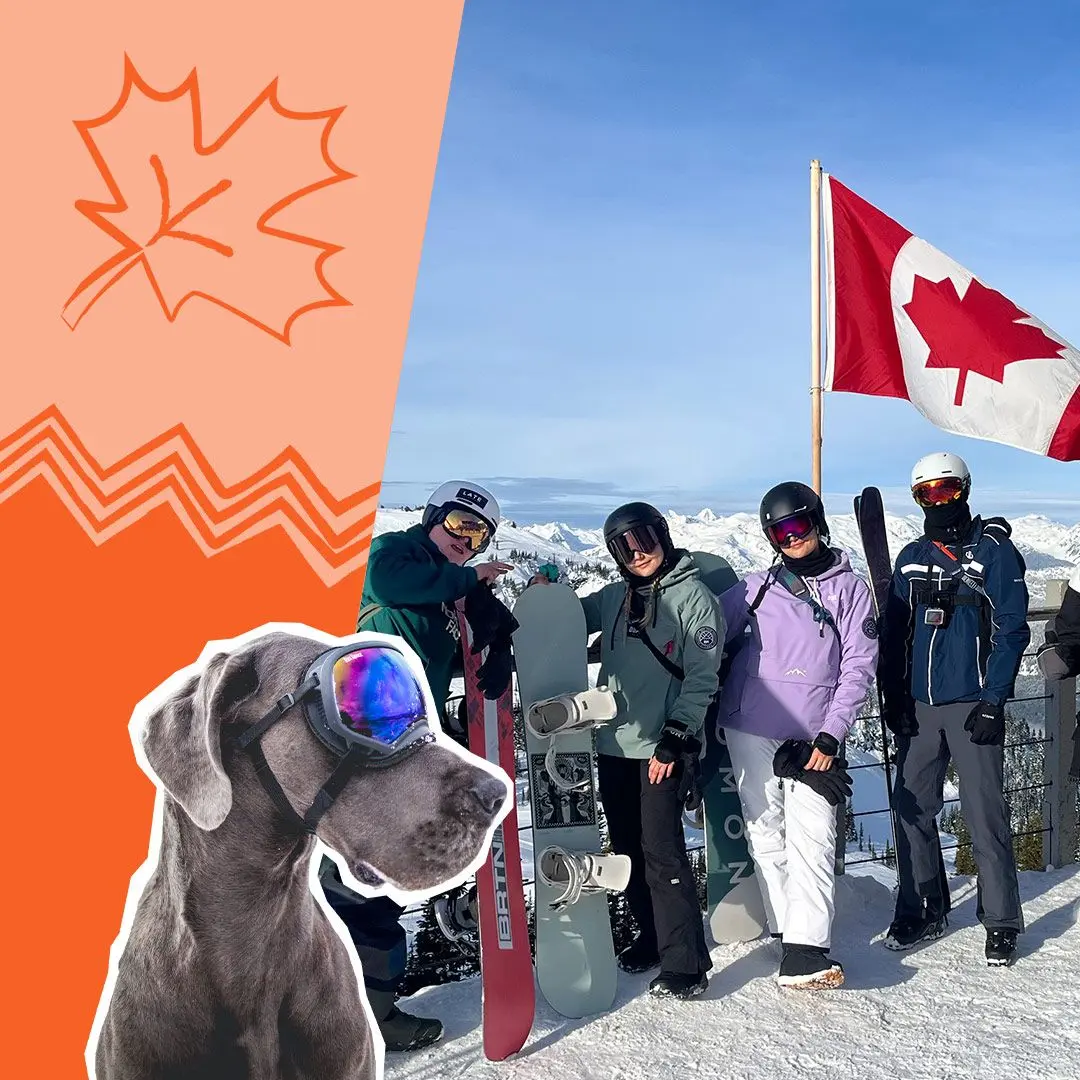 People pose with Canada flag on snowy mountain, maple leaf design in orange, dog with snow goggles