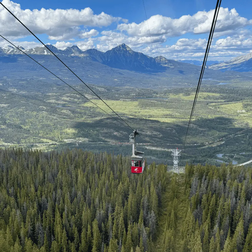 Jasper sky tram ascending with mountain and valley views