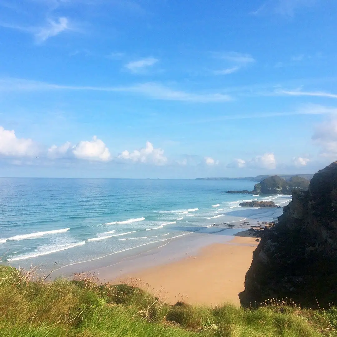 Cliffs and beach on sunny day