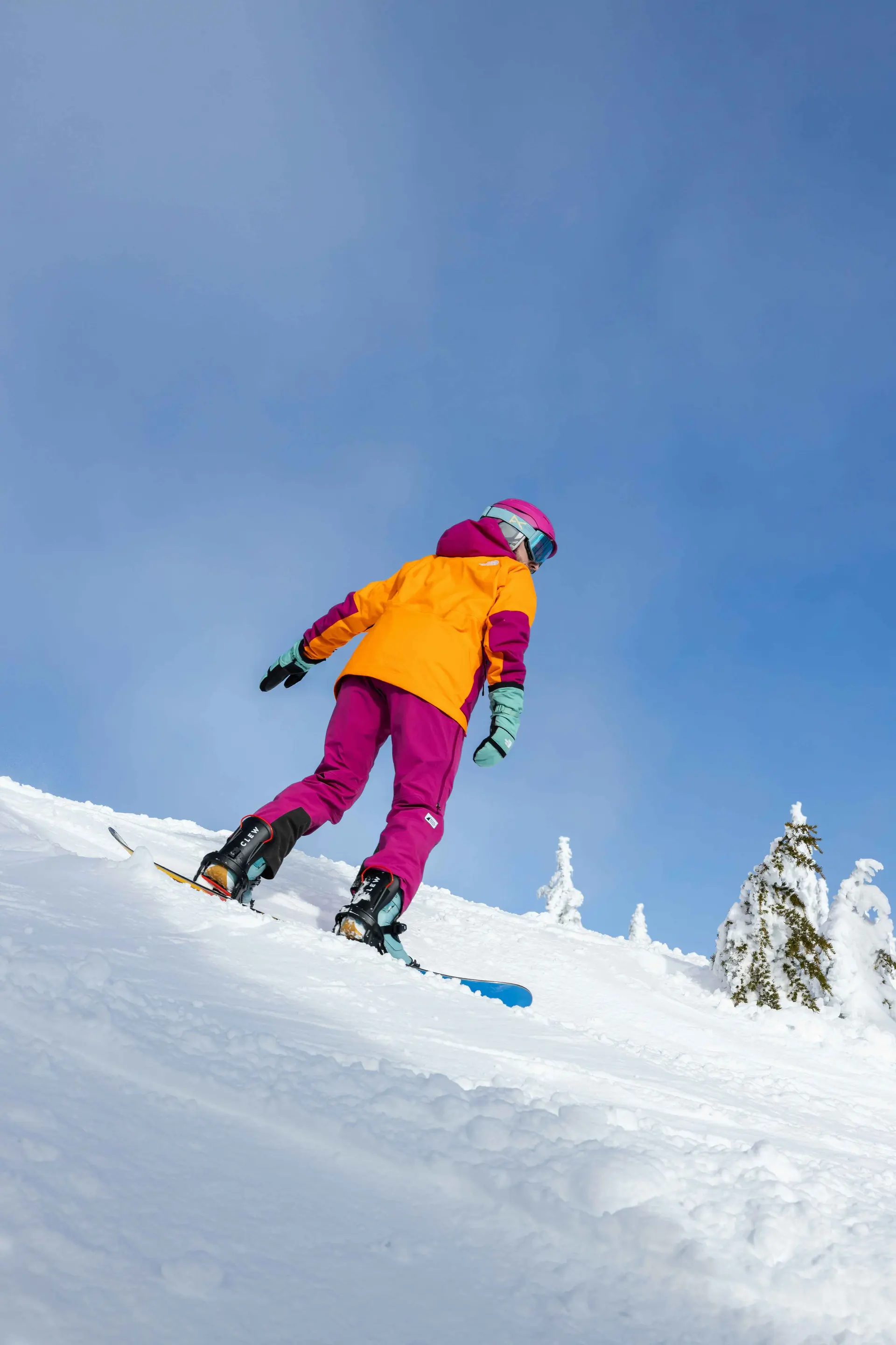 Canadian skier in bright pink and orange gear 