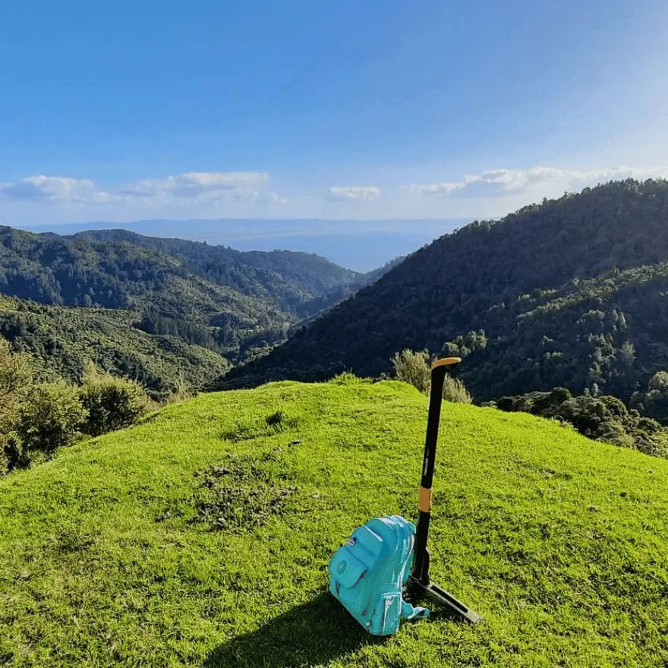 View of New Zealand landscape and work tools.